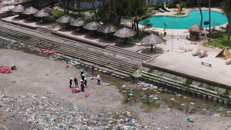 people working to solve climate crisis, cleaning beach, vietnam