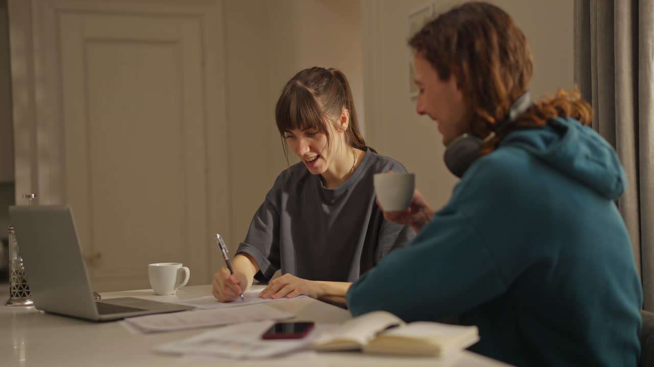 Two People Working Together at Home