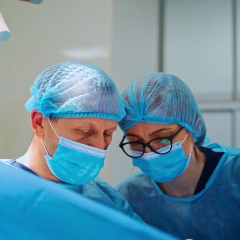 medical team of surgeons in hospital