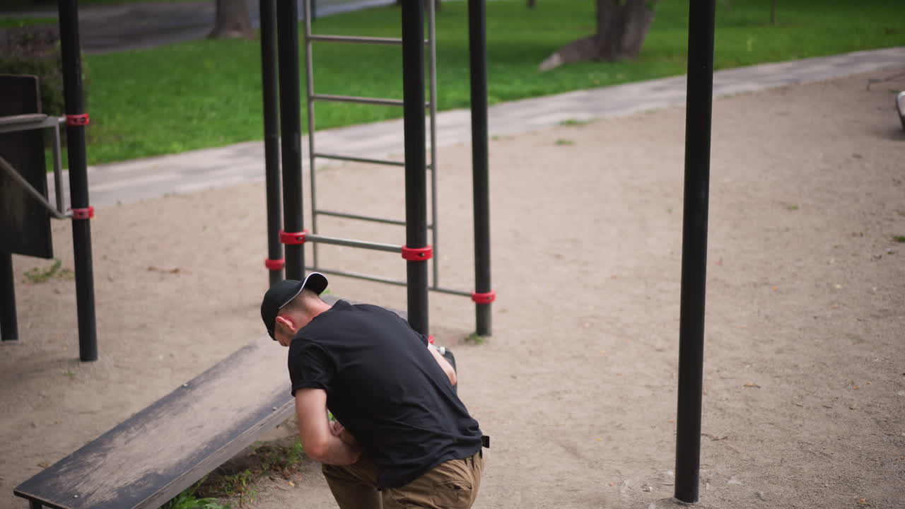 Individual Briefly Stops To Regain Composure Nearby, Nearby Man Takes Breath And Observes His Environment Carefully, Man Pauses His Steps Near Play Area To Breathe Deeply And Look Around Attentively