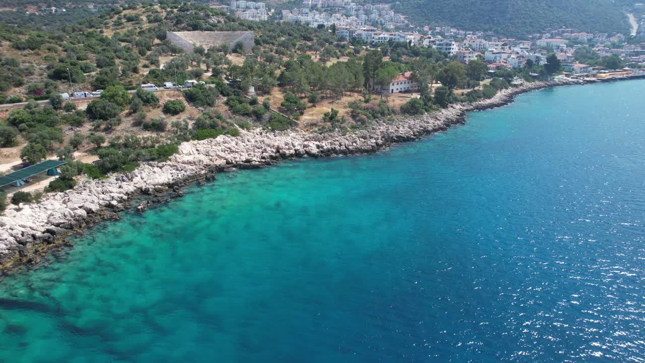 Drone shot of Kaş blue water and amphitheatre in Antalya region of T&uuml;rkiye