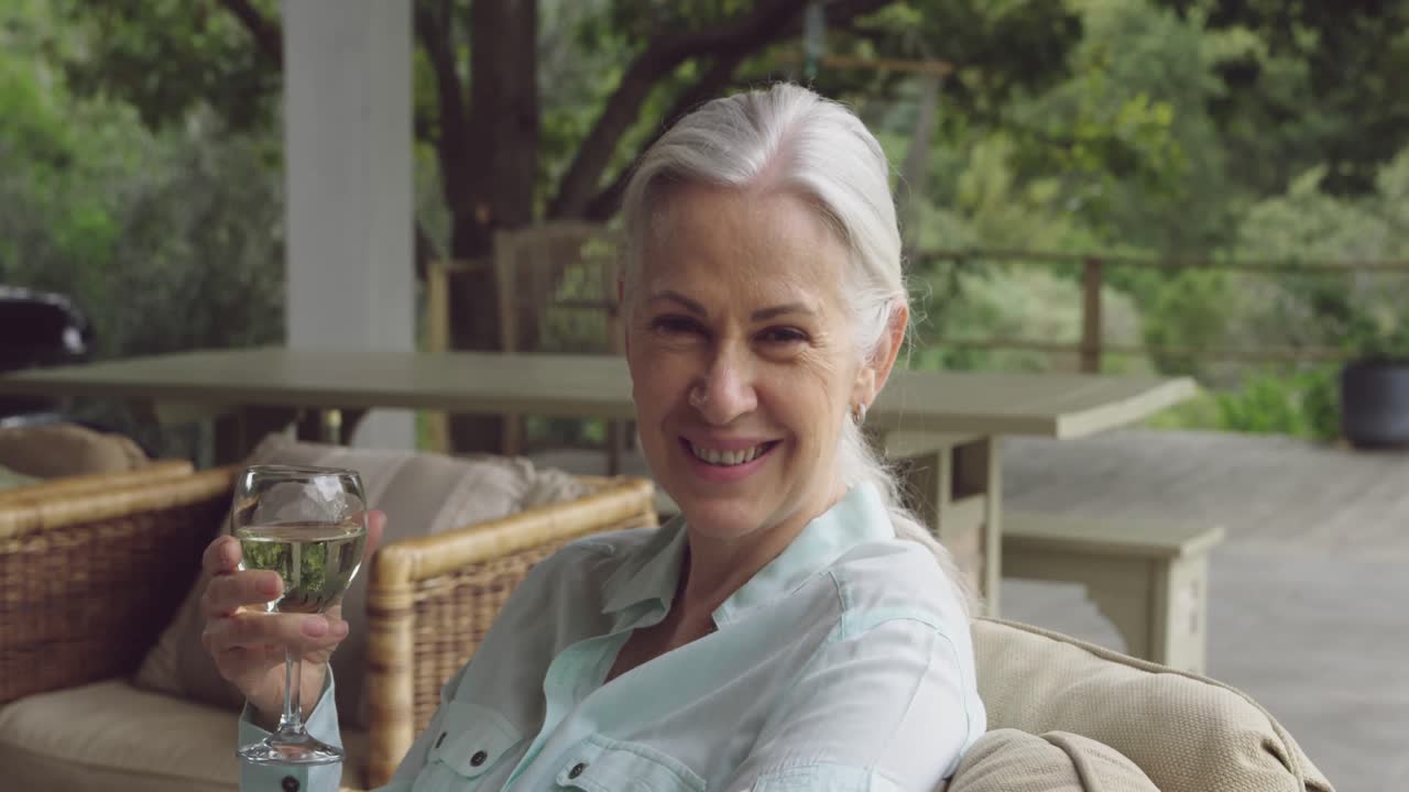 Senior woman enjoying a glass of wine