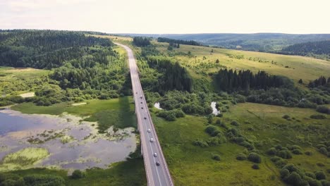 aerial view of a bridge over a river in a scenic landscape