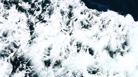 water rushes by on side of boat