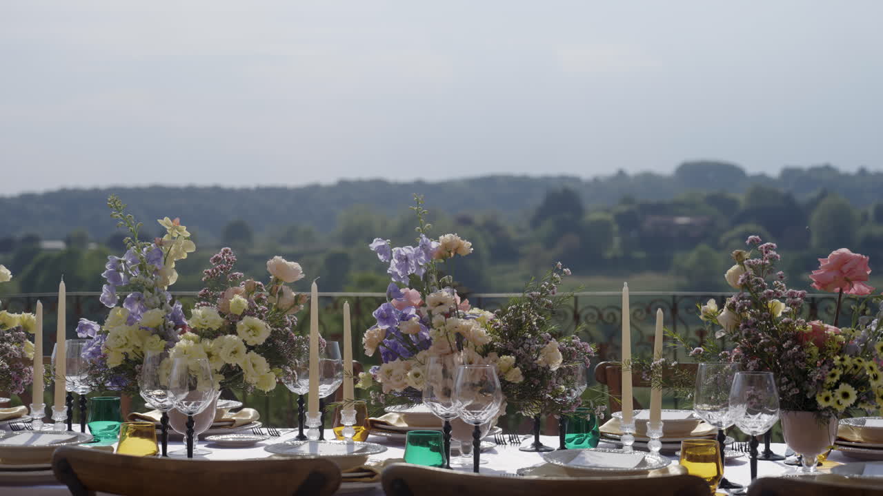 Outdoor Wedding Reception Table Setting with Beautiful Floral Arrangements