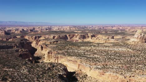 aerial view flying over canyons and gullies near chimney rock viewing area near i70 in utah