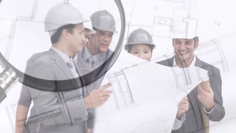 Suited-men-and-women-with-building-plans-montage-over-architectural-drawing-and-magnifying-glass