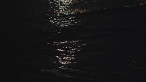 moonlight sparkling on sea waves at night