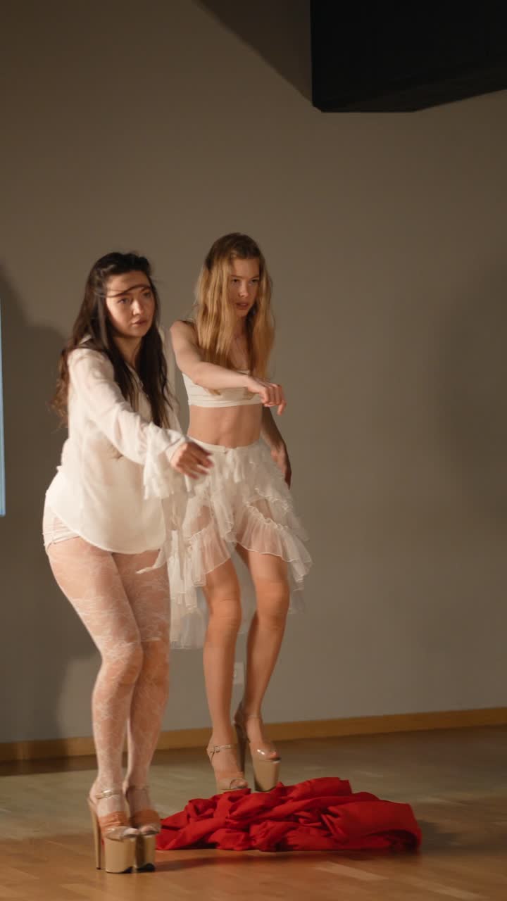 Contemporary Dance Performance with Women in White and Red