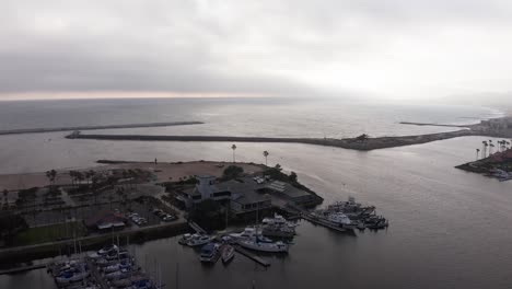 Descending-and-panning-aerial-shot-of-the-Channel-Islands-National-Park-Visitor-Center-in-Ventura,-California