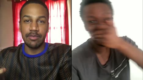 two male friends laughing over video chat