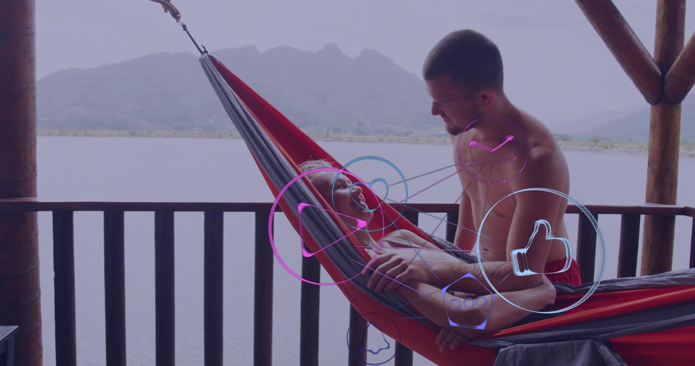 Vertical video: Leaning man kissing woman in red top in hammock on balcony, seeking touch, overlays