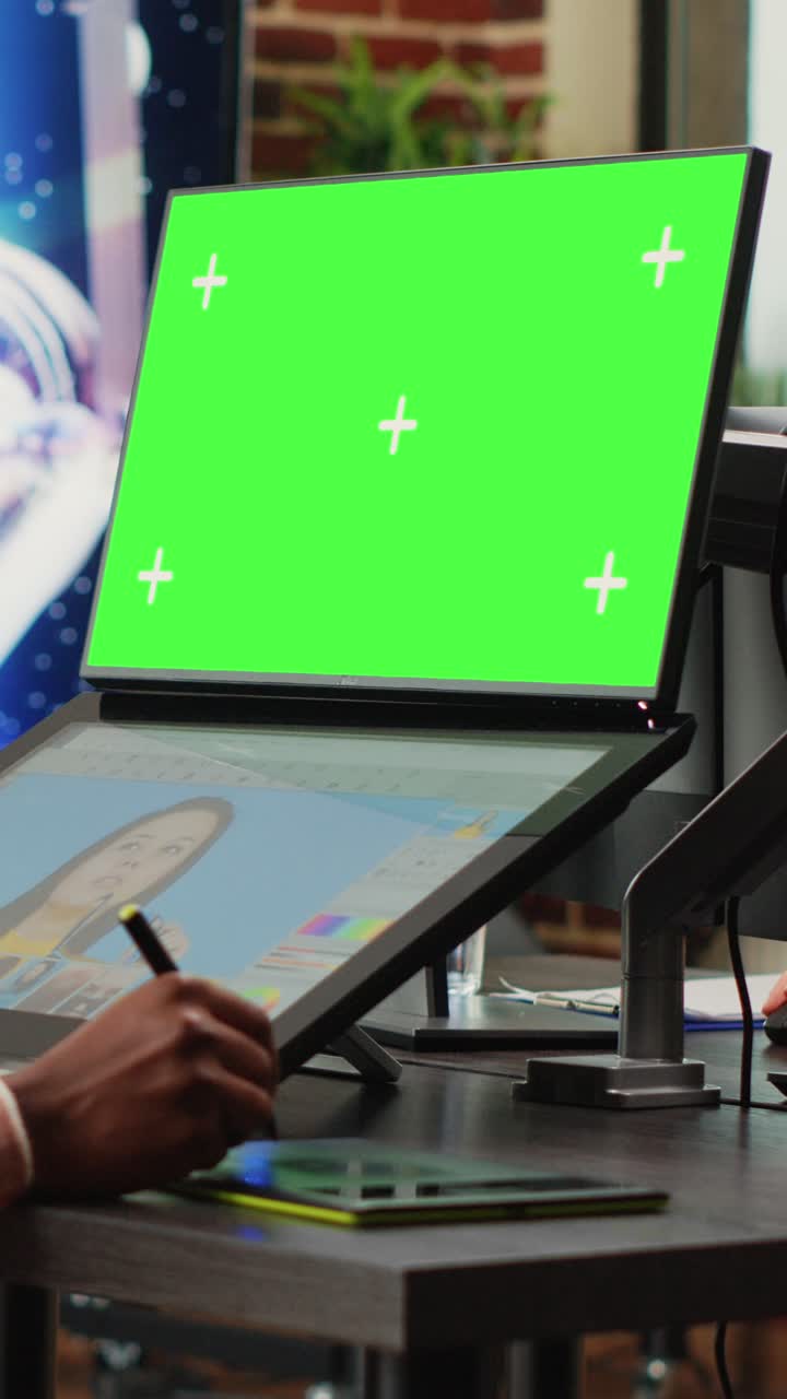 Vertical video: Young content creator using greenscreen background on computer
