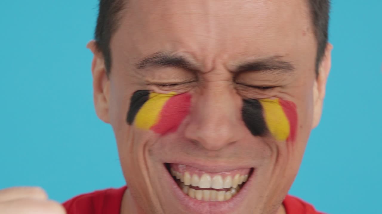 Close up of a man supporting belgian team