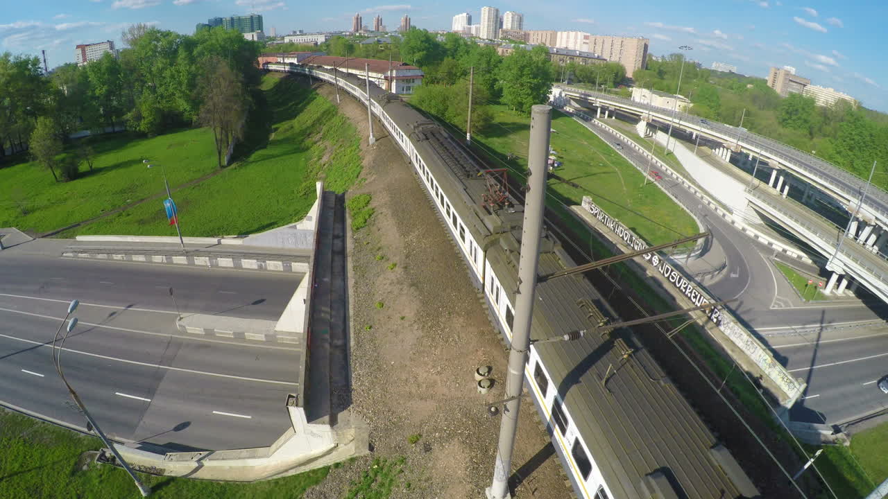 View from the bird's flight on the fast moving train on the bridge near the junction