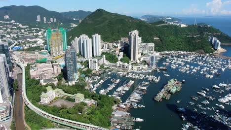 Aberdeen-harbour-and-skyline-in-southwest-Hong-Kong-island-on-a-beautiful-day,-Aerial-view