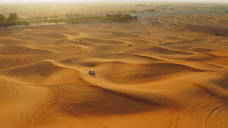 suv surfing in the desert in dubai, united arab emirates, middle east