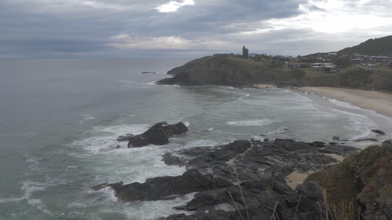 Scenic View Of Scott's Head Coastal Village In Nambucca Valley On An Overcast Day - Pacific Ocean Coast, NSW, Australia - aerial, slow motion