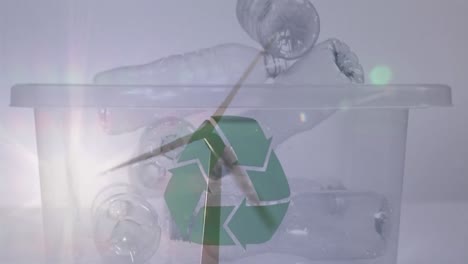 Animation-of-green-recycling-sign-over-box-with-plastic-bottles-and-wind-turbine