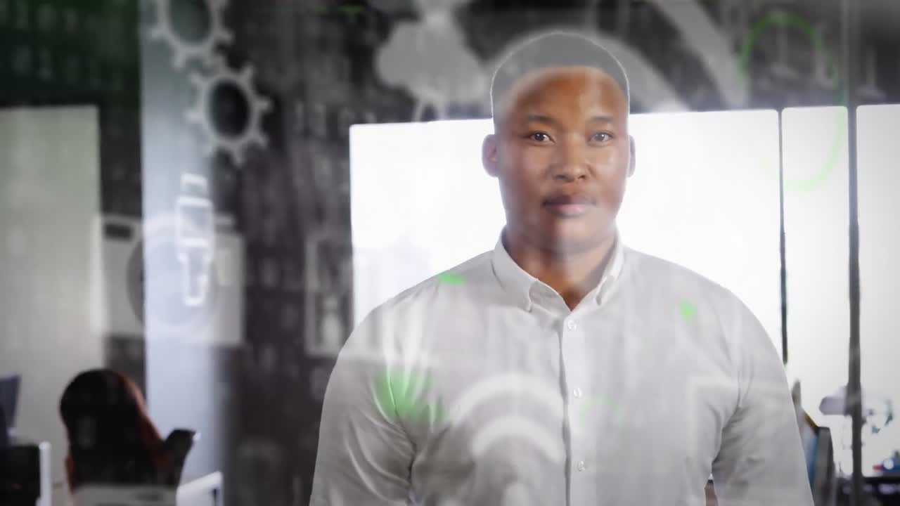 Animation of network of digital icons over businessman in office