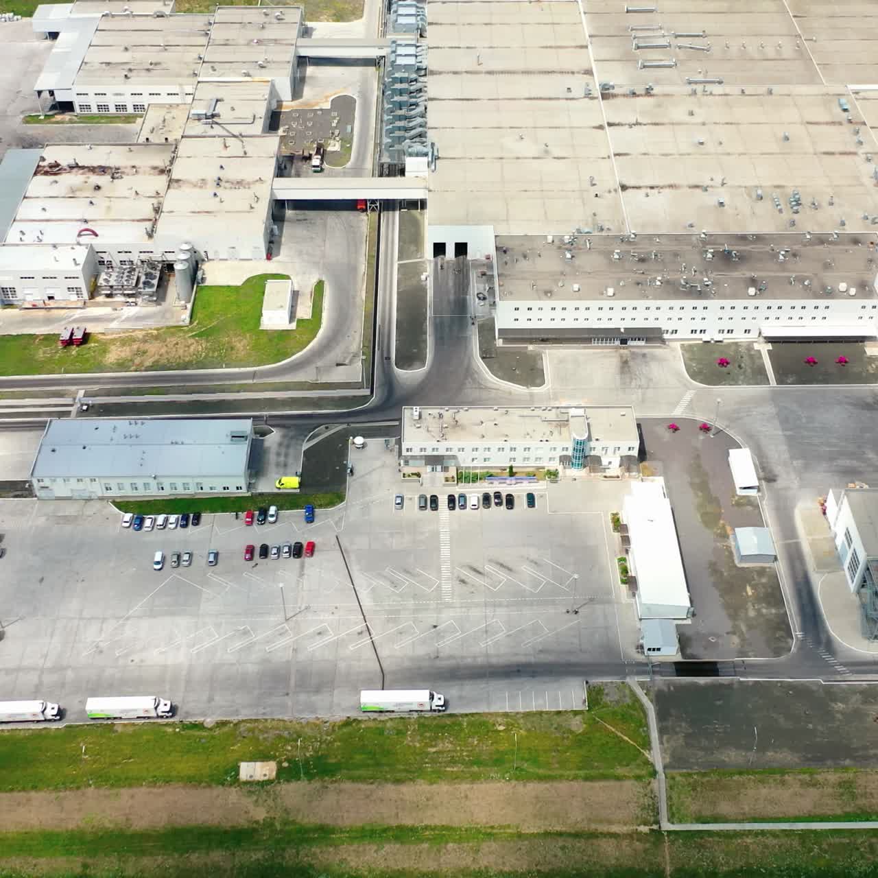 Aerial view of industrial poultry house in the country. Modern Factory Exterior