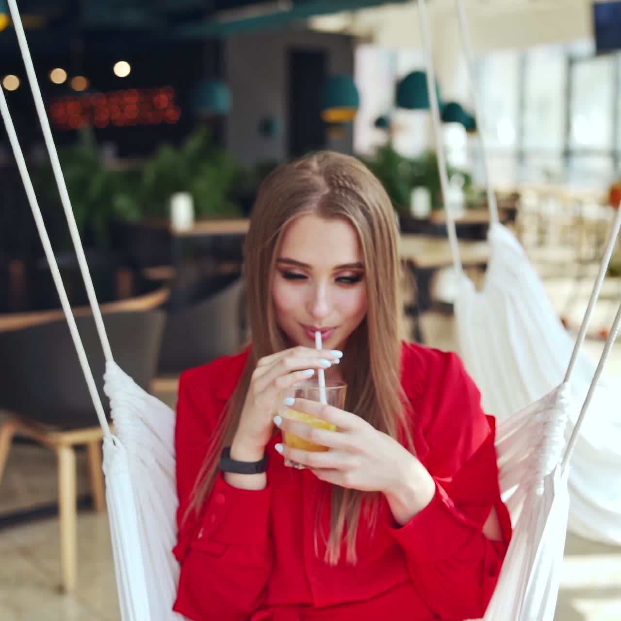 Woman sitting and drinking juice