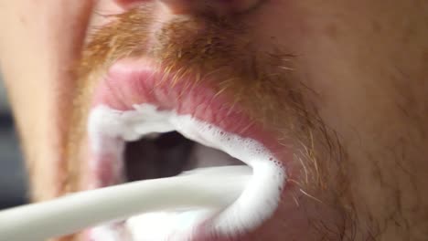 dental hygiene, close up of white man brushing his teeth with toothbrush