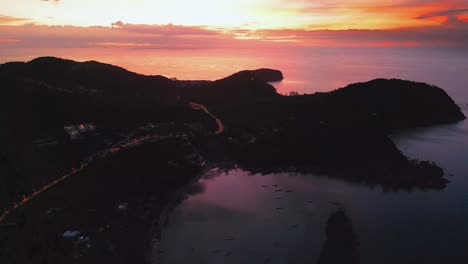 golden horizon sunset aerial view of koh pha ngan’s beach and mountain landscape