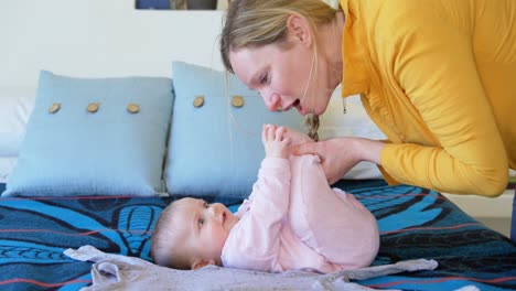 mother playing with her baby boy 4k