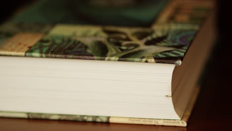 a book lying on a table, close up focus pull