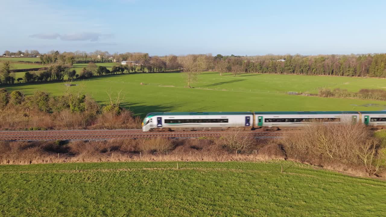Aerial View Of Train Passing By The Green Fields In County Kildare, Ireland.