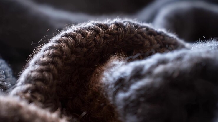 Macro di tessuto a maglia caldo con fibre visibili