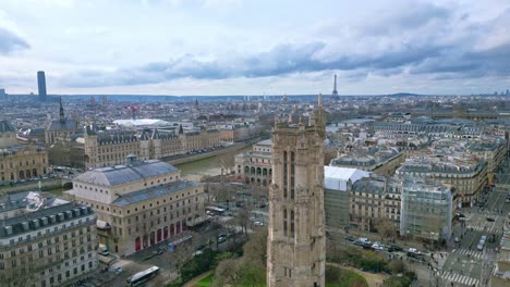 saint-jacques tower and square near seine river with tour eiffel in background, boulevard de sebastopol, paris in france