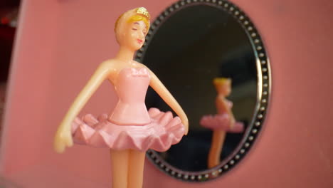 a beautiful dancing ballerina spins in a musical jewelry box