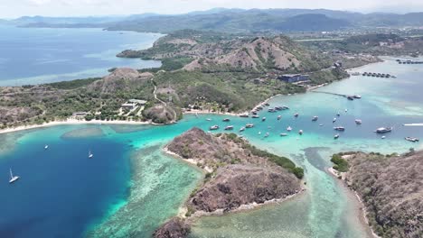 aerial shot of waecicu beach in labuan bajo, indonesia with turquoise waters