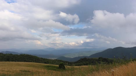 time-lapse of clouds over mountains