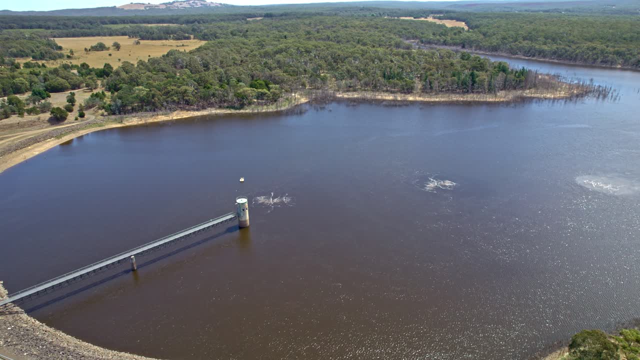 Reversing drone footage of Rosslynne Reservoir, near Gisborne, Vicoria, Australia. January 2025