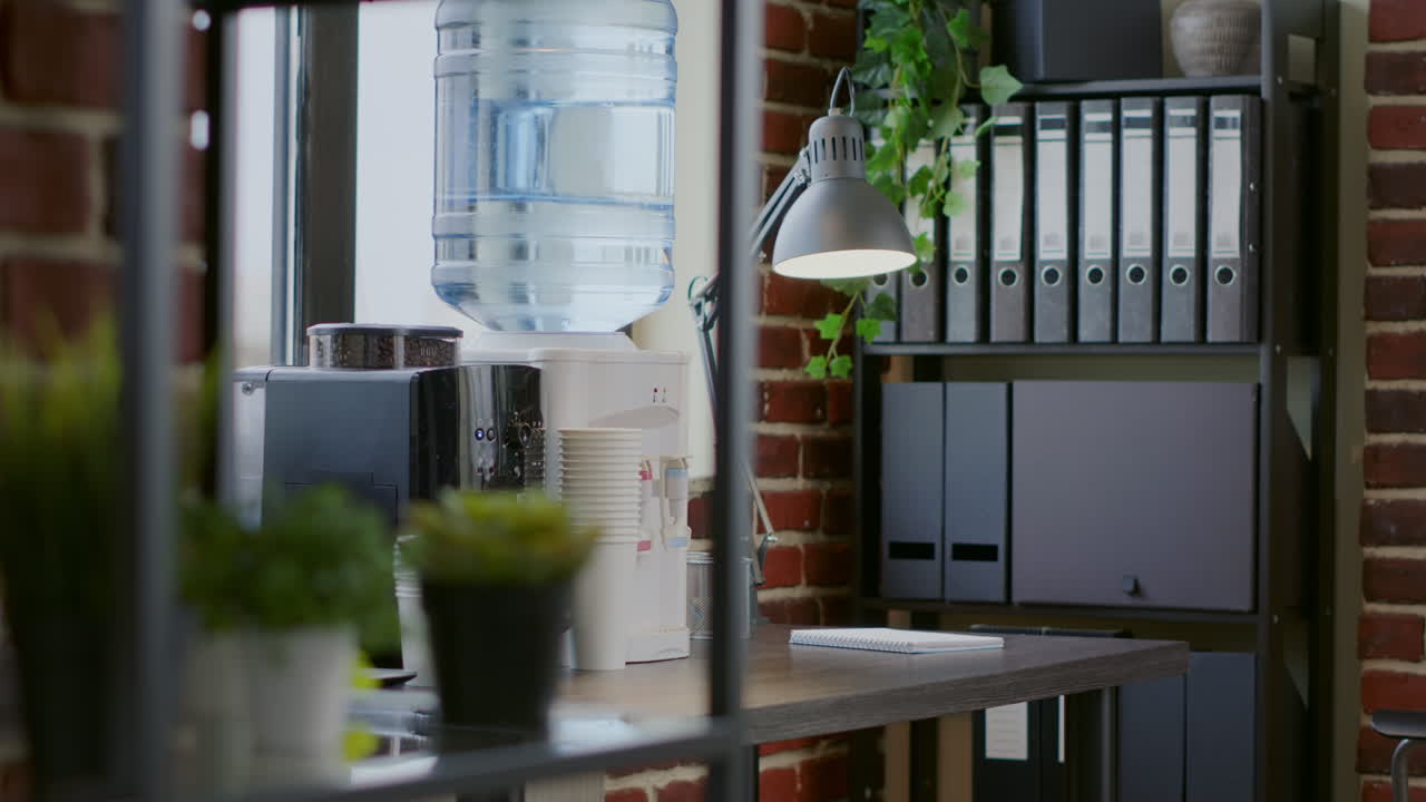 Close up of water cooler and coffee machine on table