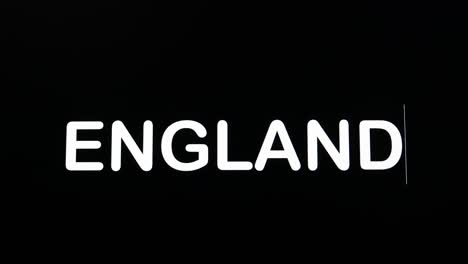 typing the word england on a screen with a black background