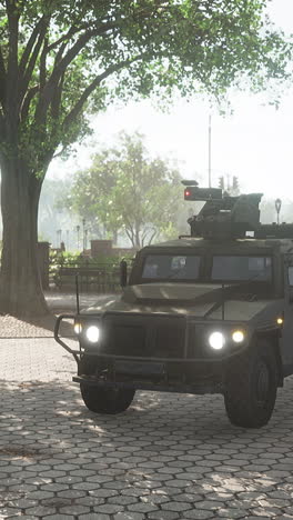 a military truck parked in a city park