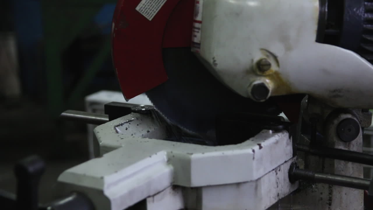 Cutting steel elements with an automatic machine saw, technological work with steel, close up