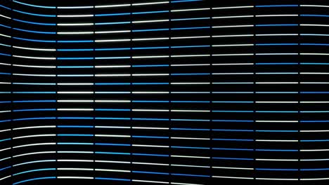 abstract vertical rows of multicolored neon stripes moving on black background. animation. animation of seamless loop, thick stripes flying