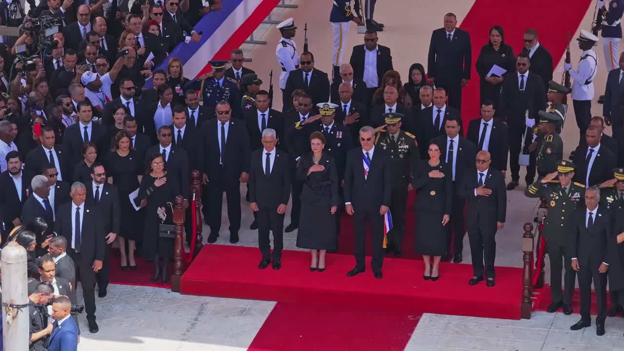 Solemn official ceremony with dignitaries and military personnel