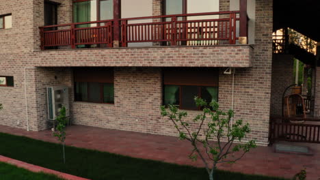opening rolling shutter windows protection of a luxury modern house, in a village in moldova, morning