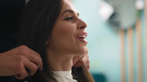 Handheld-view-of-beautiful-woman-sitting-in-hair-salon