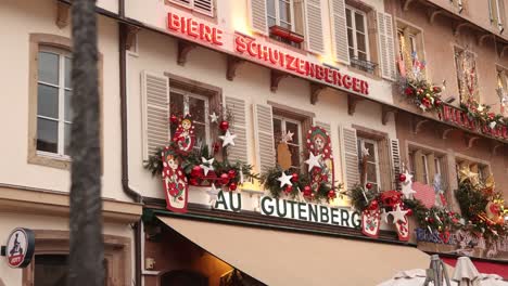 neon biere sign above a restaurant in european market square at a festive christmas market in europe