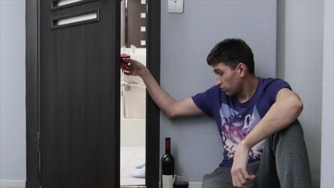 a man drinking wine in a downward spiral