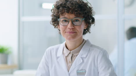 portrait of joyous female doctor at work