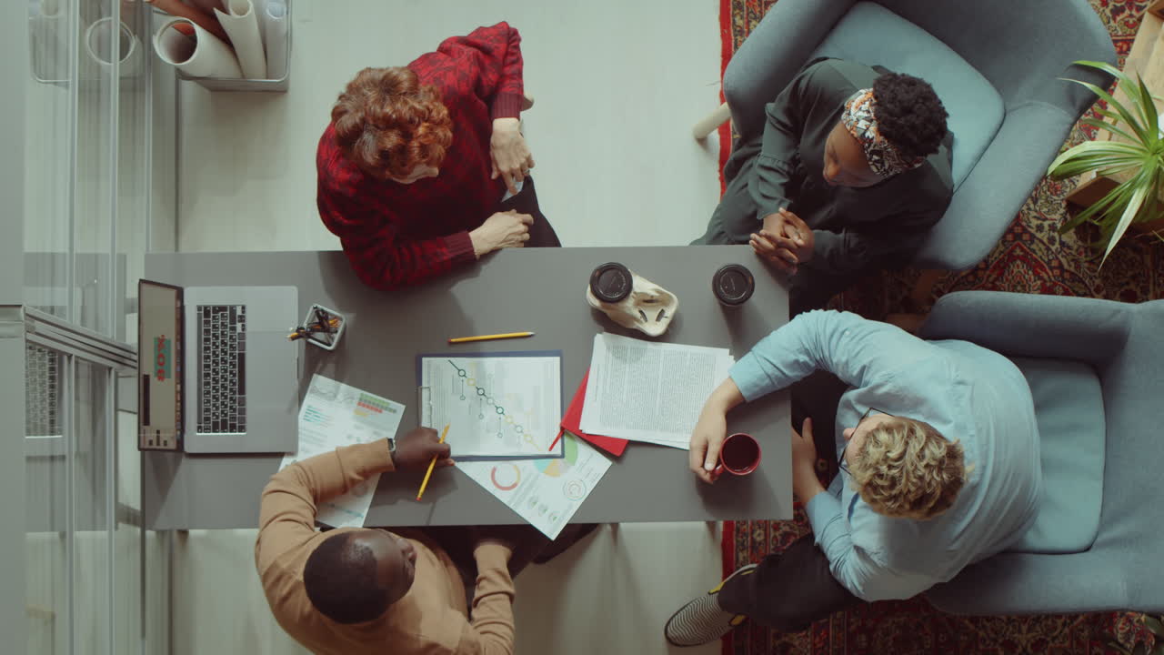 Business Team Stacking Hands at Office Meeting