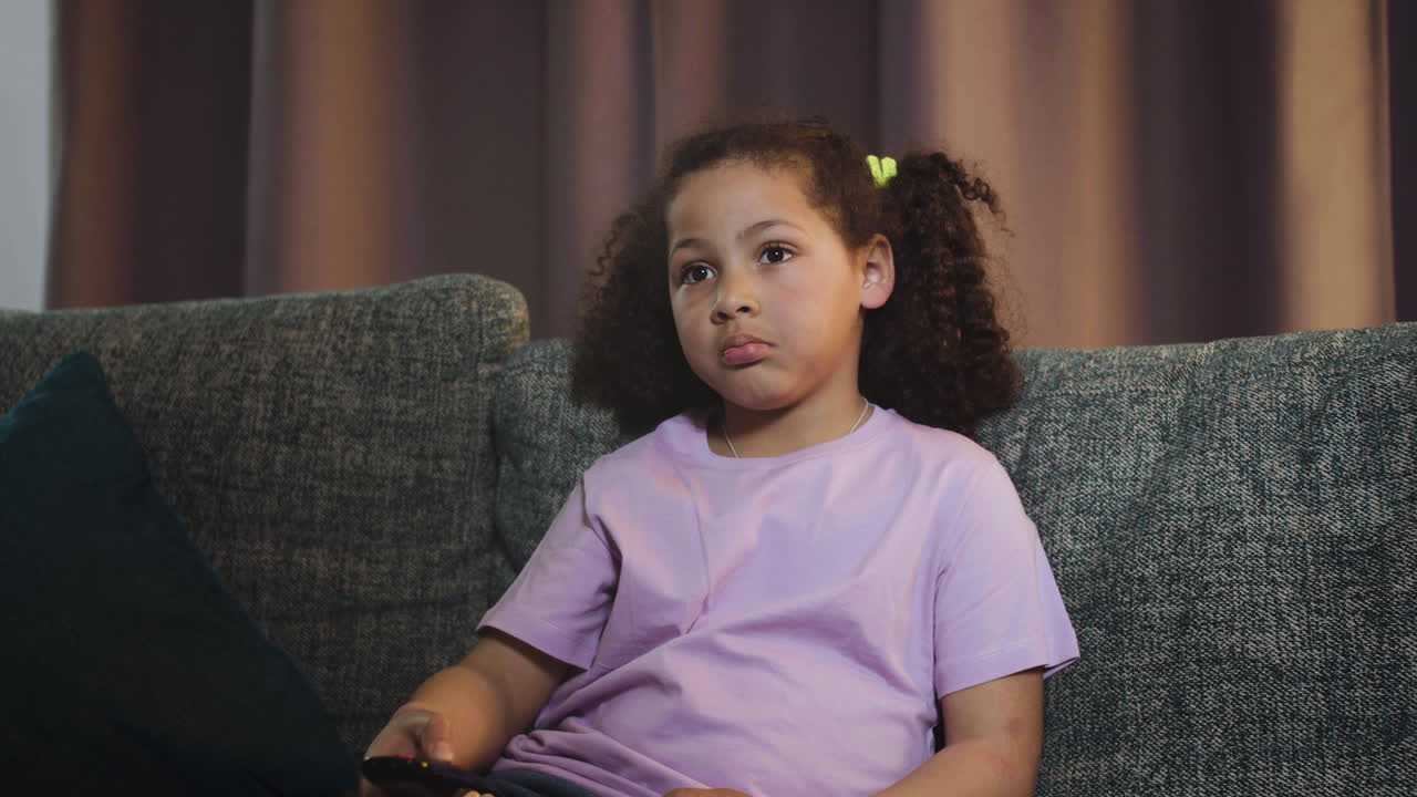 Kid watching film at home | Free Stock Video Footage